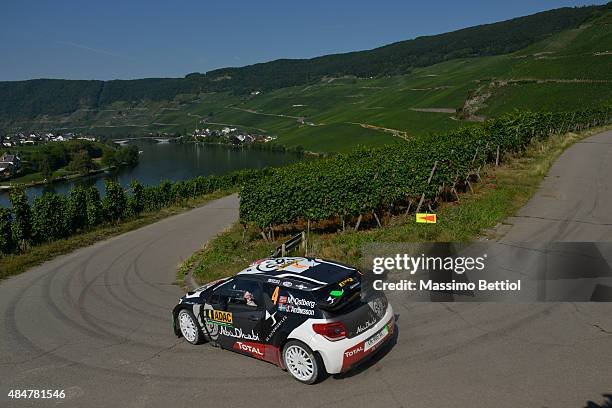 Mads Ostberg of Norway and Jonas Andersson of Sweden compete in their Citroen Total Abu Dhabi WRT Citroen DS3 WRC during Day One of the WRC Germany...
