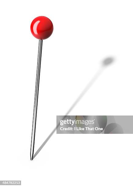pin stuck into a white surface - punaise stockfoto's en -beelden