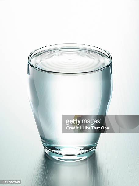 glass full of water - drinking glass stock pictures, royalty-free photos & images