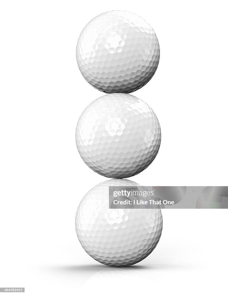 Three golf balls stacked on-top of each other