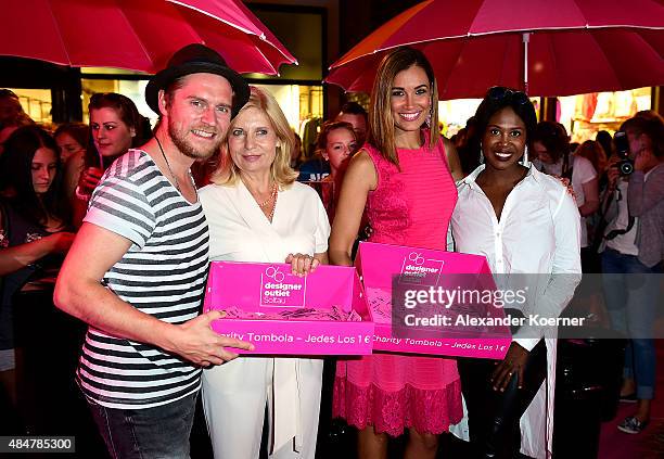 Johannes Oerding, Sabine Postel, Jana Ina Zarella and Motsi Mabuse are pictured during the Late Night Shopping at Designer Outlet Soltau on August...