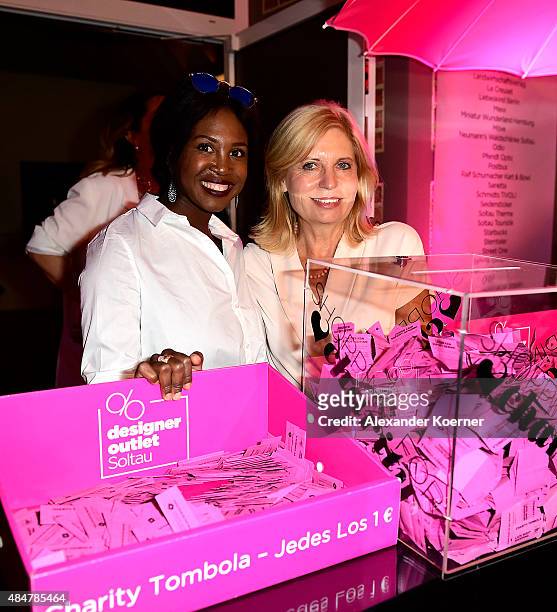 Sabine Postel and Motsi Mabuse are pictured during the Late Night Shopping at Designer Outlet Soltau on August 21, 2015 in Soltau, Germany.