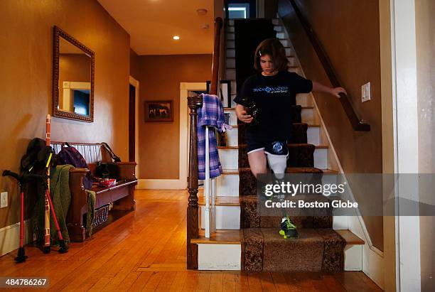 Jane Richard runs down the stairs at home as she gets ready to leave for an appointment at Spaulding on February 10, 2014. Back at school, her...