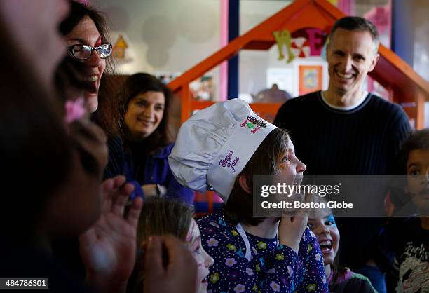 Jane Richard reacts to a magician after he performed a card trick during her birthday party at Ginger Betty's in Quincy on February 16, 2014. For...