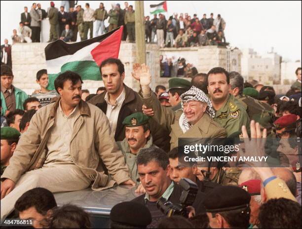 Palestinian Authority's President Yasser Arafat shown in picture dated 19 January 1997 as he gets a triumphant welcome by tens of thousands of...