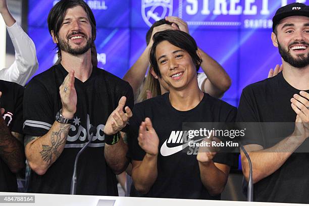 Professional skateboarders Chris Cole and Sean Malto of Street League Skateboarding ring the NASDAQ Closing Bell at NASDAQ MarketSite on August 21,...