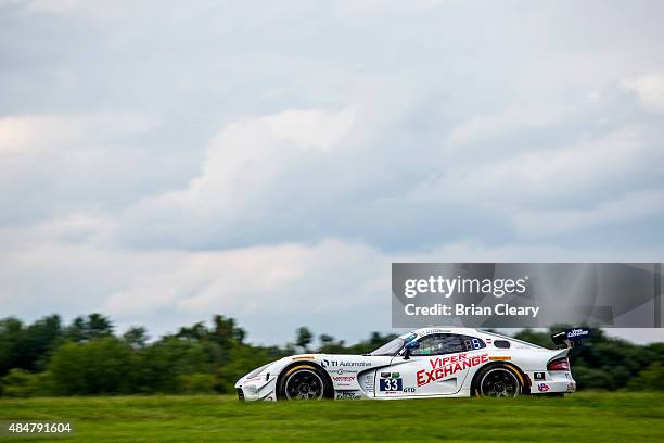 The Dodge Viper SRT of Ben Keating and Jeroen Bleekemolen drives during practice for the IMSA Tudor Series GT race at Virginia International Raceway...