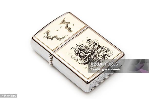 zippo scrimshaw lighter - green lighter stock pictures, royalty-free photos & images