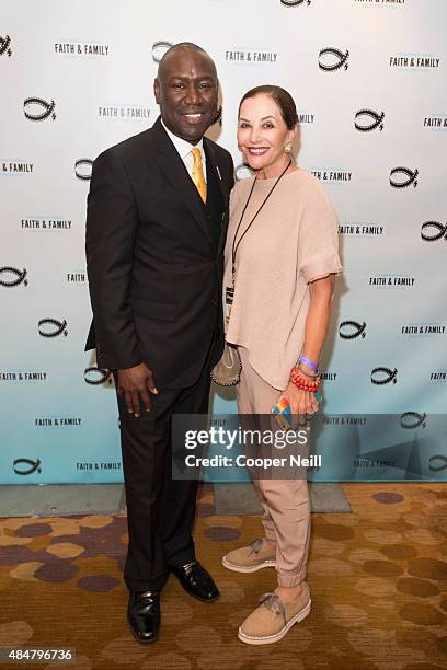 Benjamin Crump and Jan Miller pose for a photo before the '3 1/2 Minutes, 10 Bullets' screening during MegaFest on August 21, 2015 in Dallas, Texas.