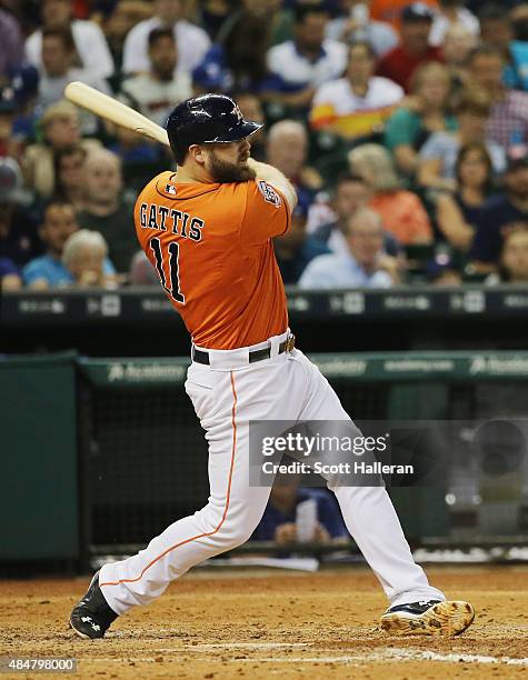 Evan Gattis of the Houston Astros connects on a solo home run in the sixth inning during their game against the Los Angeles Dodgers at Minute Maid...