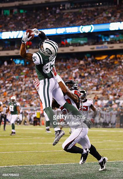 DeVier Posey of the New York Jets scores a touchdown against Dezmen Southward of the Atlanta Falcons in the third quarter during their pre season...