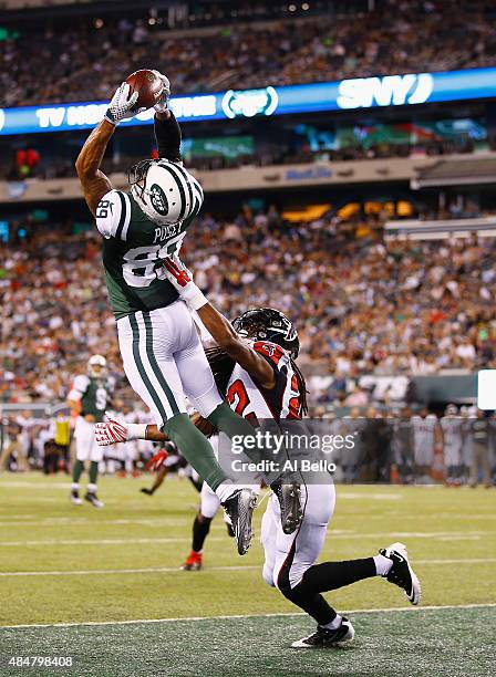 DeVier Posey of the New York Jets scores a touchdown against Dezmen Southward of the Atlanta Falcons in the third quarter during their pre season...