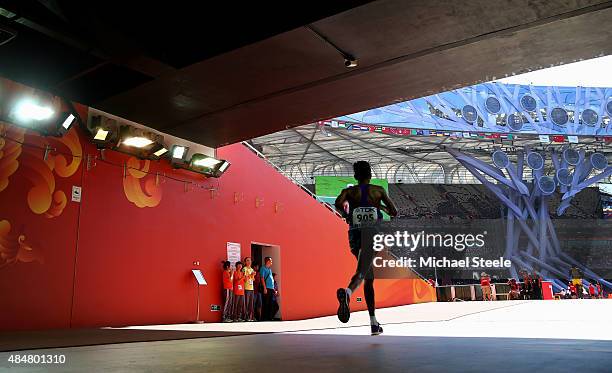 Anuradha Cooray of Sri Lanka enters the stadium during the Men's Marathon during day one of the 15th IAAF World Athletics Championships Beijing 2015...