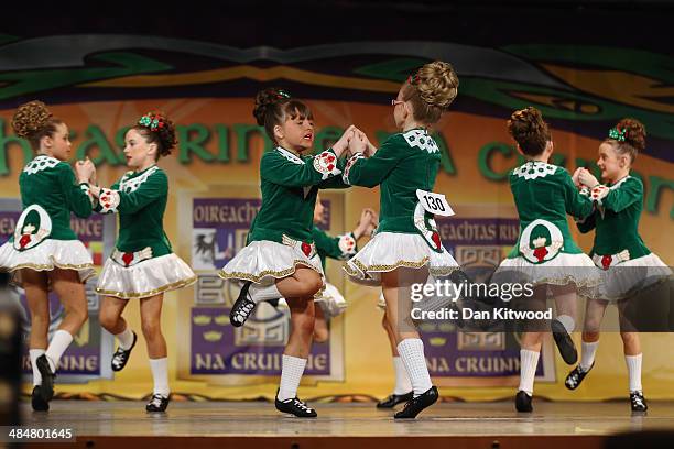 An under 11's dance group from the Fleming Ball dance school in Munster, Ireland, performs a Ceili dance during the World Irish Dance Championship on...