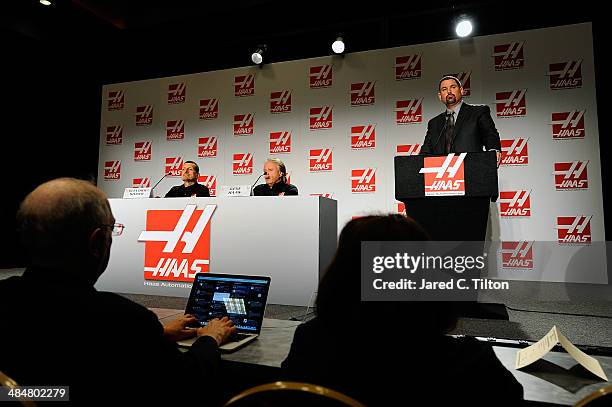 The media looks on as Guenther Steiner, team principal of Haas Formula, Gene Haas, founder, Haas Automation and chairman, Haas Formula, and Mike...