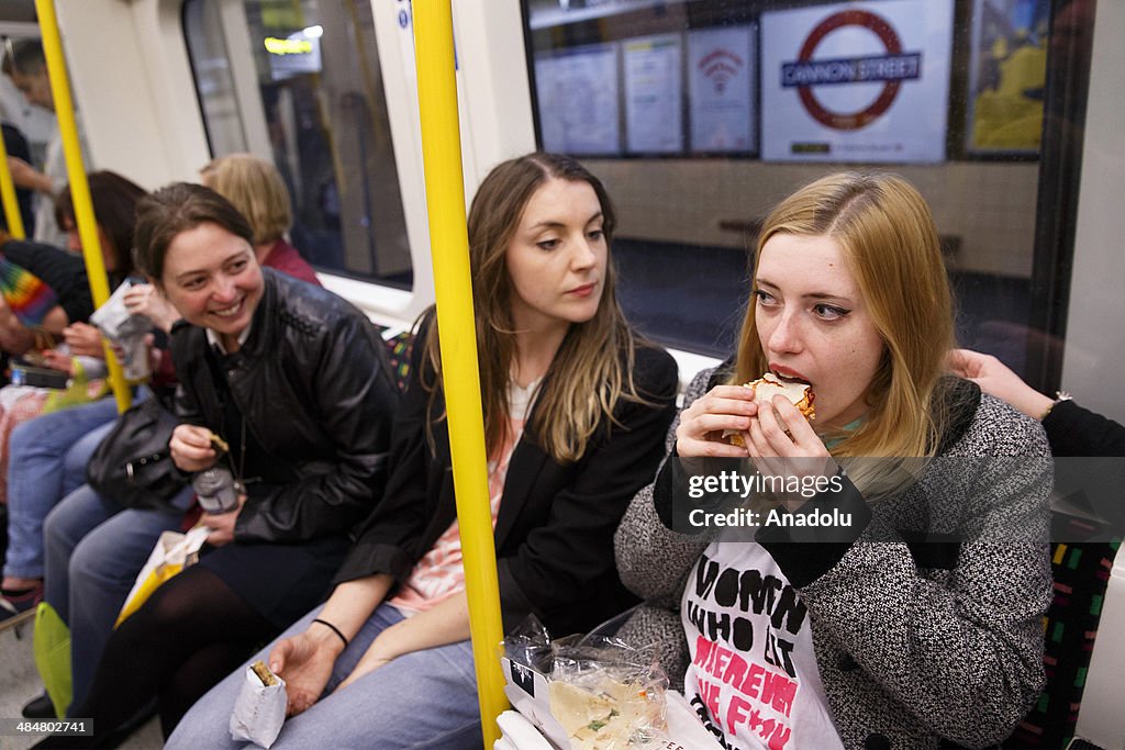 'Women Eating on the Tube' having lunch party