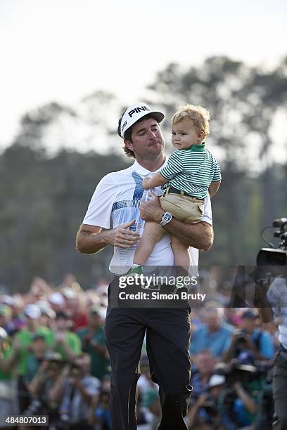 Bubba Watson victorious with his son Caleb Watson at No 18 hole after winning tournament on Sunday at Augusta National. Augusta, GA 4/13/2014 CREDIT:...