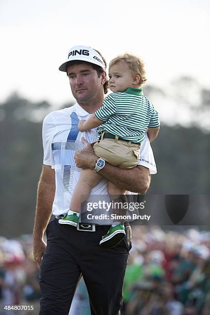 Bubba Watson victorious with his son Caleb Watson at No 18 hole after winning tournament on Sunday at Augusta National. Augusta, GA 4/13/2014 CREDIT:...