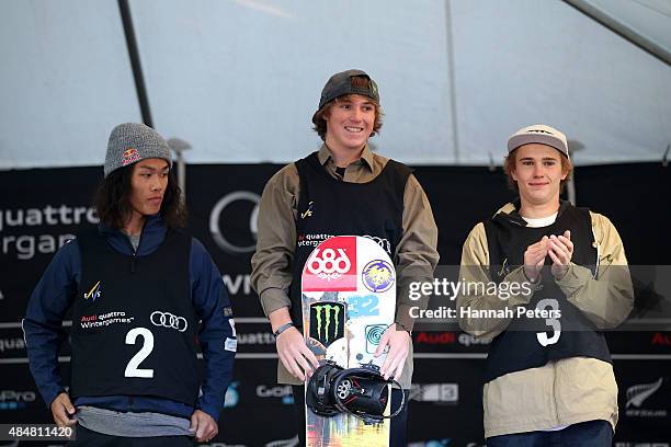 Second place Yuki Kadono of Japan, first place Chris Corning of the United States and Michael Ciccarelli of Canada pose on the podium during the...