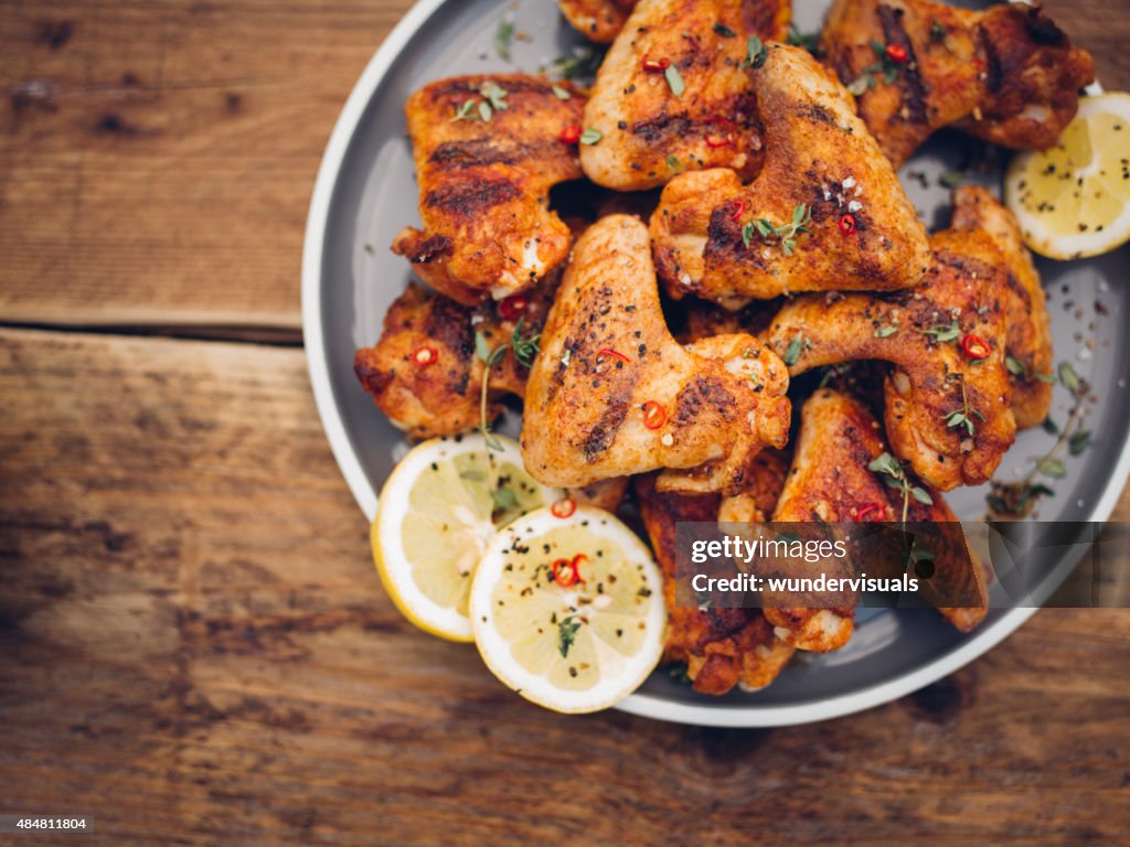 Crispy chillie sprinkled chicken wings on a plate