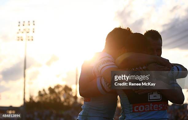 Michael Gordon of the Sharks celebrates his try with Luke Lewis and Jack Bird during the round 24 NRL match between the Cronulla Sharks and the Wests...