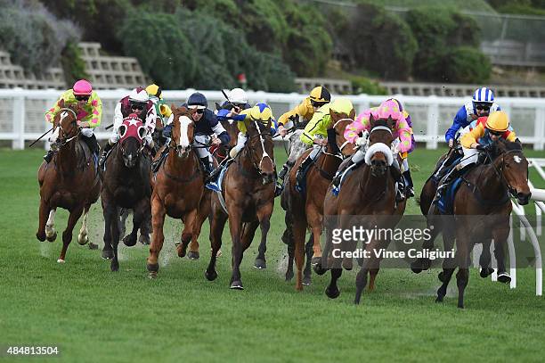 Damian Lane riding The United States turns into the straight before winning Race 8, the IPrint Carlyon Stakes during Melbourne racing at Moonee...