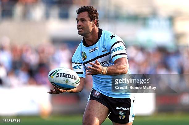 Jayson Bukuya of the Sharks passes the ball during the round 24 NRL match between the Cronulla Sharks and the Wests Tigers at Remondis Stadium on...