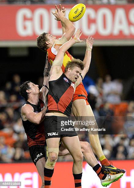 Tom Lynch of the Suns takes a mark during the round 21 AFL match between the Gold Coast Suns and the Essendon Bombers at Metricon Stadium on August...