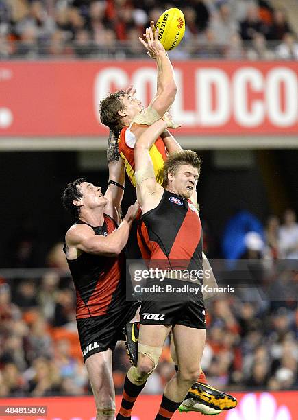 Tom Lynch of the Suns takes a mark during the round 21 AFL match between the Gold Coast Suns and the Essendon Bombers at Metricon Stadium on August...