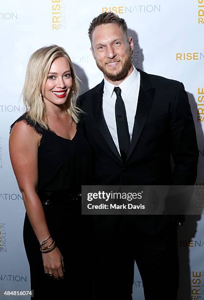 Actress Hilary Duff and personal/celebrity trainer Jason Walsh attend 'Rise Nation Fitness Studio's Los Angeles Grand Opening' on August 21, 2015 in...