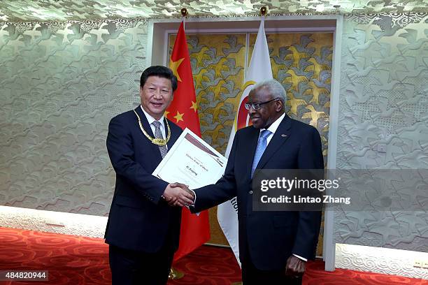 General Secretary of the Communist Party of China and the President of the People's Republic of China Xi Jinping receives the The IAAF Golden Order...