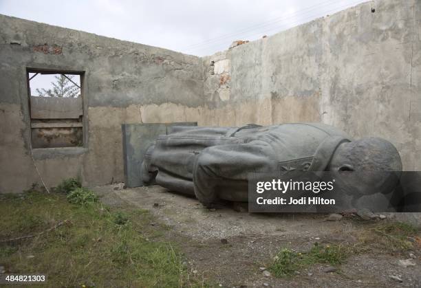 Winter Games Preview: View of Joseph Stalin statue in an abandoned building on the outskirts of his hometown. The Stalin statue was removed from the...