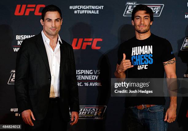 Opponents Sheldon Westcott and Elias Theodorou pose for photos during the UFC Ultimate Media Day at the TRYP Quebec Hotel on April 14, 2014 in Quebec...