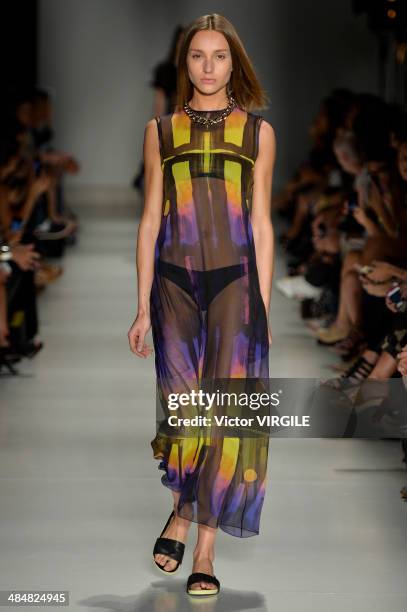 Model walks the runway at Vitorino Campos show during Sao Paulo Fashion Week Summer 2014/2015 at Parque Candido Portinari on April 1, 2014 in Sao...