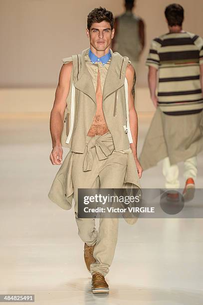 Evandro Soldati walks the runway at Triton show during Sao Paulo Fashion Week Summer 2014/2015 at Parque Candido Portinari on April 1, 2014 in Sao...