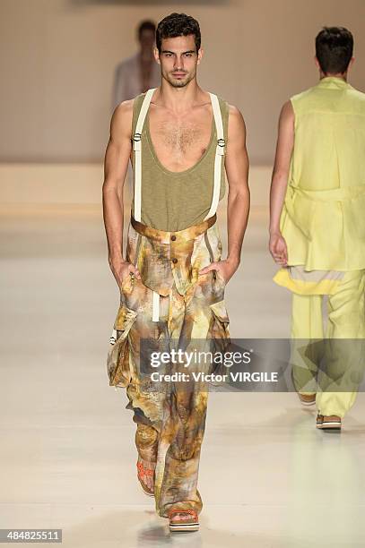 Model walks the runway at Triton show during Sao Paulo Fashion Week Summer 2014/2015 at Parque Candido Portinari on April 1, 2014 in Sao Paulo,...