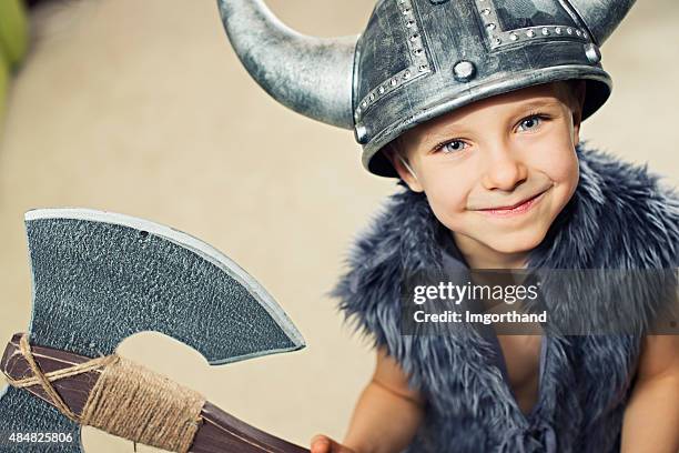 happy little boy disfrazado barbarian guerrero - hacha fotografías e imágenes de stock