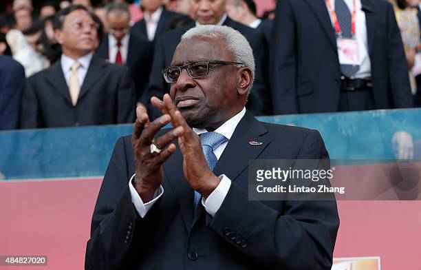 Outgoing president of the IAAF Lamine Diack applauds during day one of the 15th IAAF World Athletics Championships Beijing 2015 at Beijing National...