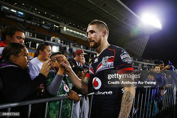 Sam Tomkins of the Warriors thanks the supporters for the last time at home after losing the round 24 NRL match between the New Zealand Warriors and...