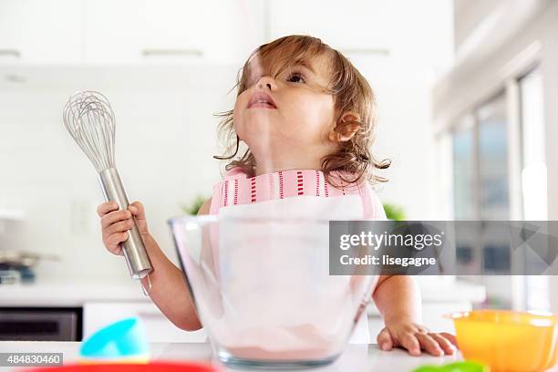 little girl preparing jello - gelatin powder stock pictures, royalty-free photos & images