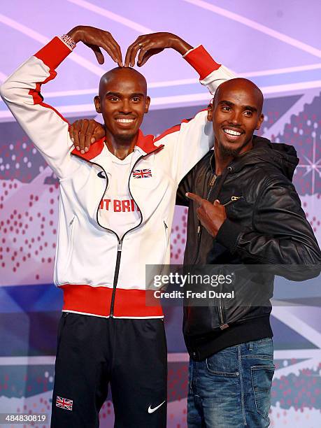 Mo Farah unveils his wax figures for London and Blackpool attractions at Madame Tussauds on April 14, 2014 in London, England.