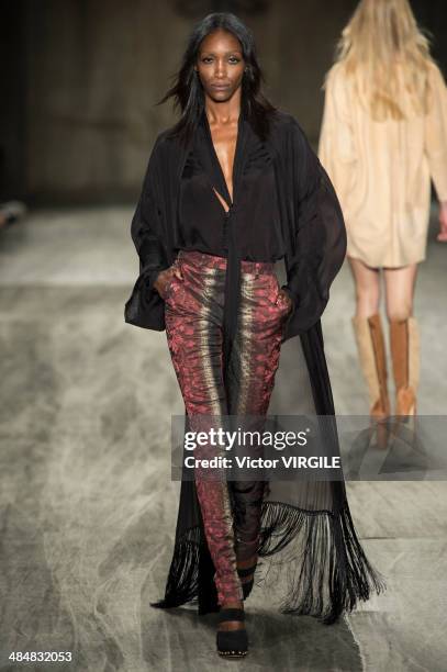 Model walks at the runway during Cavalera show during Sao Paulo Fashion Week Summer 2014/2015 at Parque Candido Portinari on March 31, 2014 in Sao...