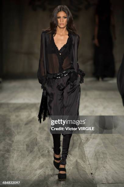 Model walks at the runway during Cavalera show during Sao Paulo Fashion Week Summer 2014/2015 at Parque Candido Portinari on March 31, 2014 in Sao...