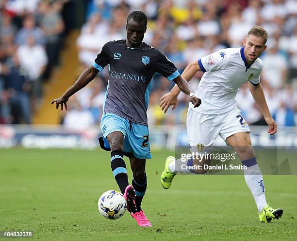 Liam Palmer of Sheffield Wednesday FC maintainls control over Charlie Taylor of Leeds United FC during the Sky Bet Championship match between Leeds...