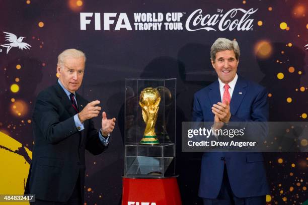 Vice President Joe Biden and U.S. Secretary of State John Kerry unveil the World Cup trophy during a FIFA World Cup Trophy Tour event, at the U.S....