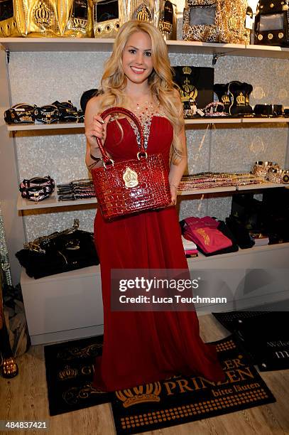 Angelina Heger poses with a handbag the Harald Gloeoeckler Store Opening on April 14, 2014 in Berlin, Germany.