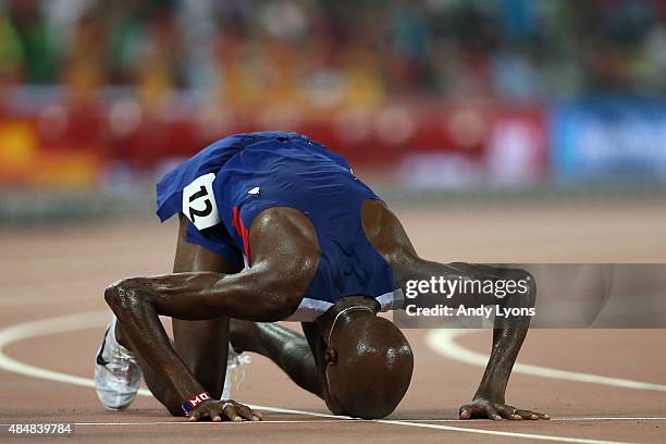 Mohamed Farah of Great Britain reacts after winning gold in the Men's 10000 metres final during day one of the 15th IAAF World Athletics...