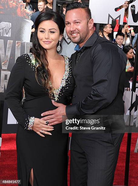 Jenni 'Jwoww' Farley and Roger Mathews arrives at the 2014 MTV Movie Awards at Nokia Theatre L.A. Live on April 13, 2014 in Los Angeles, California.