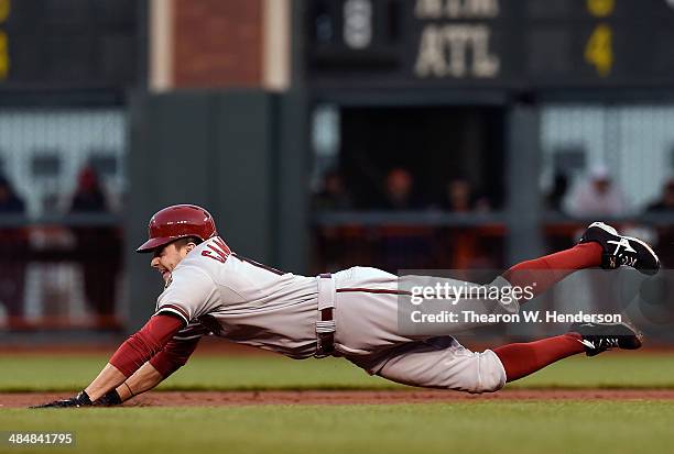 Tony Campana of the Arizona Diamondbacks dives into second base attempting to steal against the San Francisco Giants in the first inning at AT&T Park...