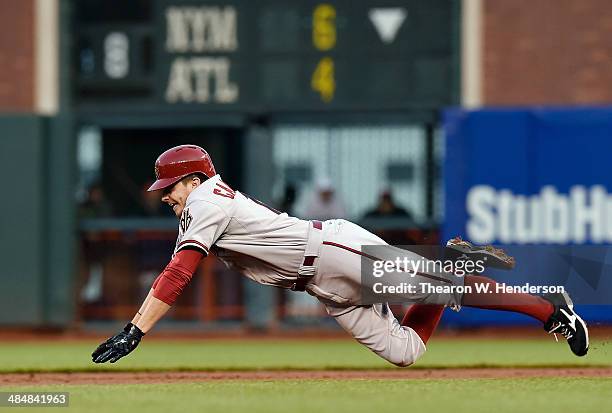 Tony Campana of the Arizona Diamondbacks dives into second base attempting to steal against the San Francisco Giants in the first inning at AT&T Park...